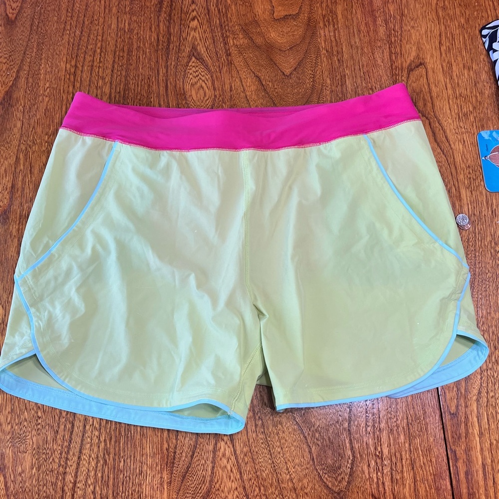 Yellow with pink detail. 5 inch inseam. Lands End